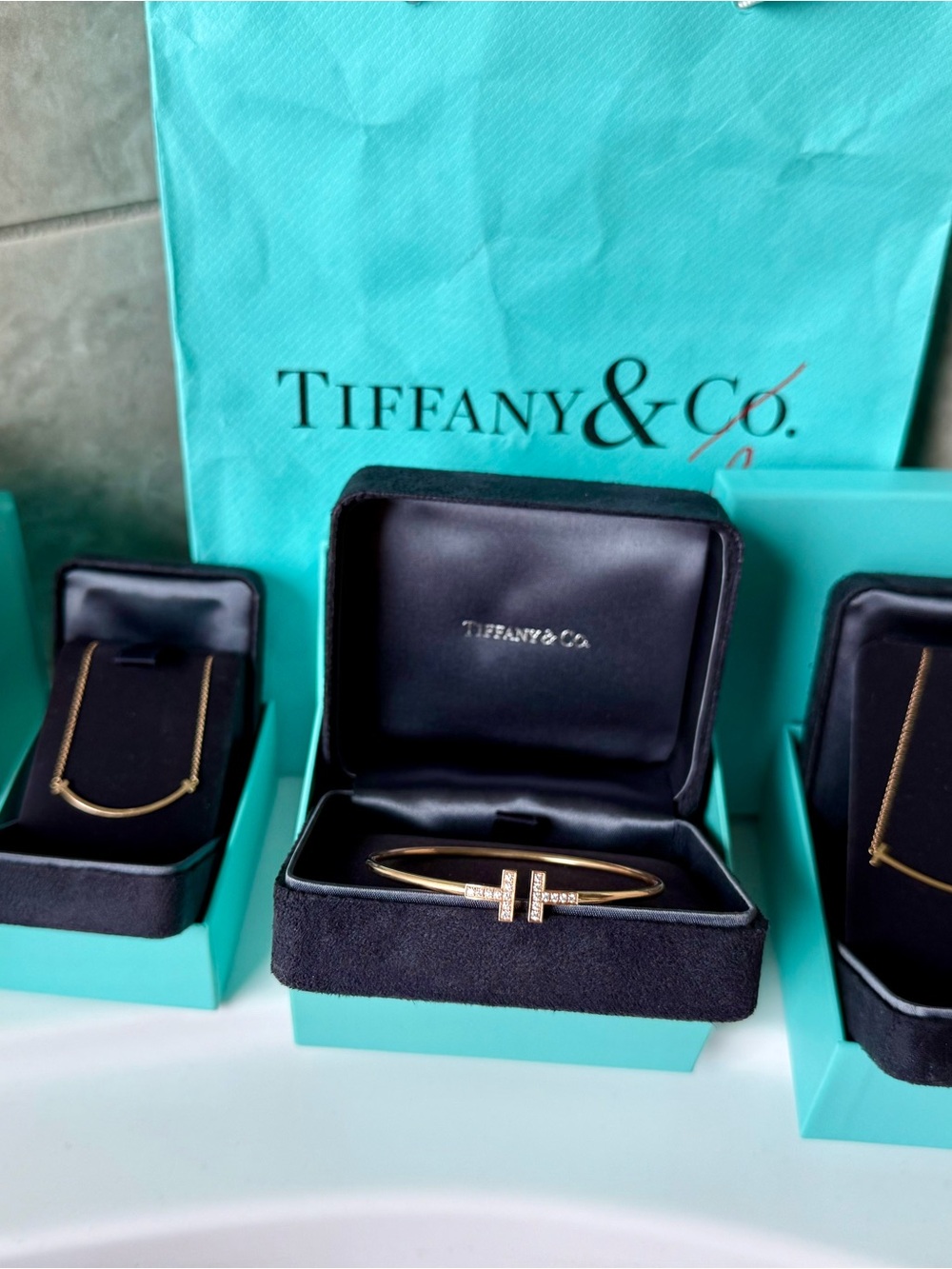 Tiffany & Co. T bundle (diamond bracelet, small and medium Smile necklaces)